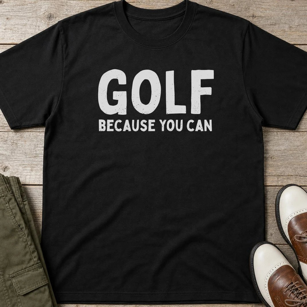 Because You Can T-Shirt in Black lying on a plain floor. T-shirt is a unisex cut and 100 per cent cotton.