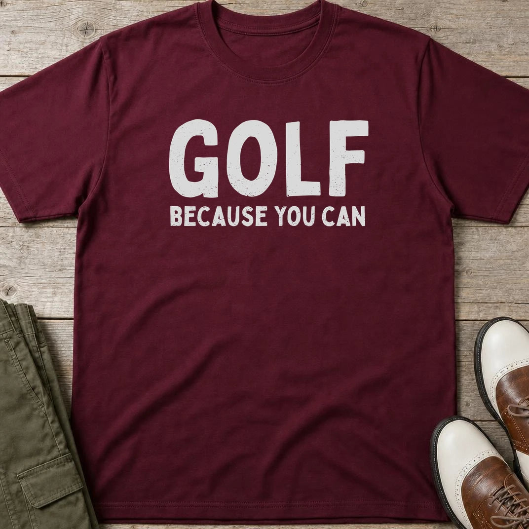 Because You Can T-Shirt in Maroon lying on a plain floor. T-shirt is a unisex cut and 100 per cent cotton.