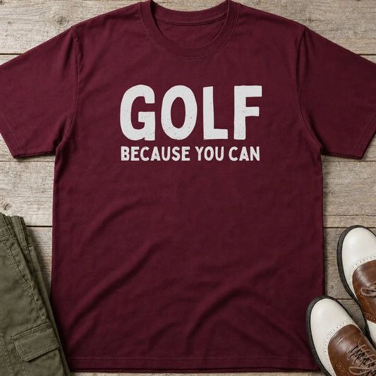 Because You Can T-Shirt in Maroon lying on a plain floor. T-shirt is a unisex cut and 100 per cent cotton.