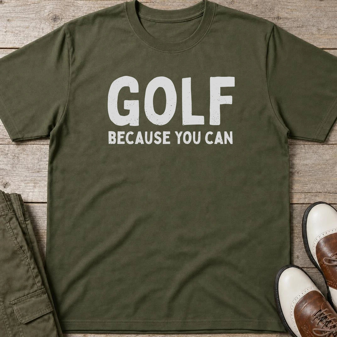 Because You Can T-Shirt in Military Green lying on a plain floor. T-shirt is a unisex cut and 100 per cent cotton.