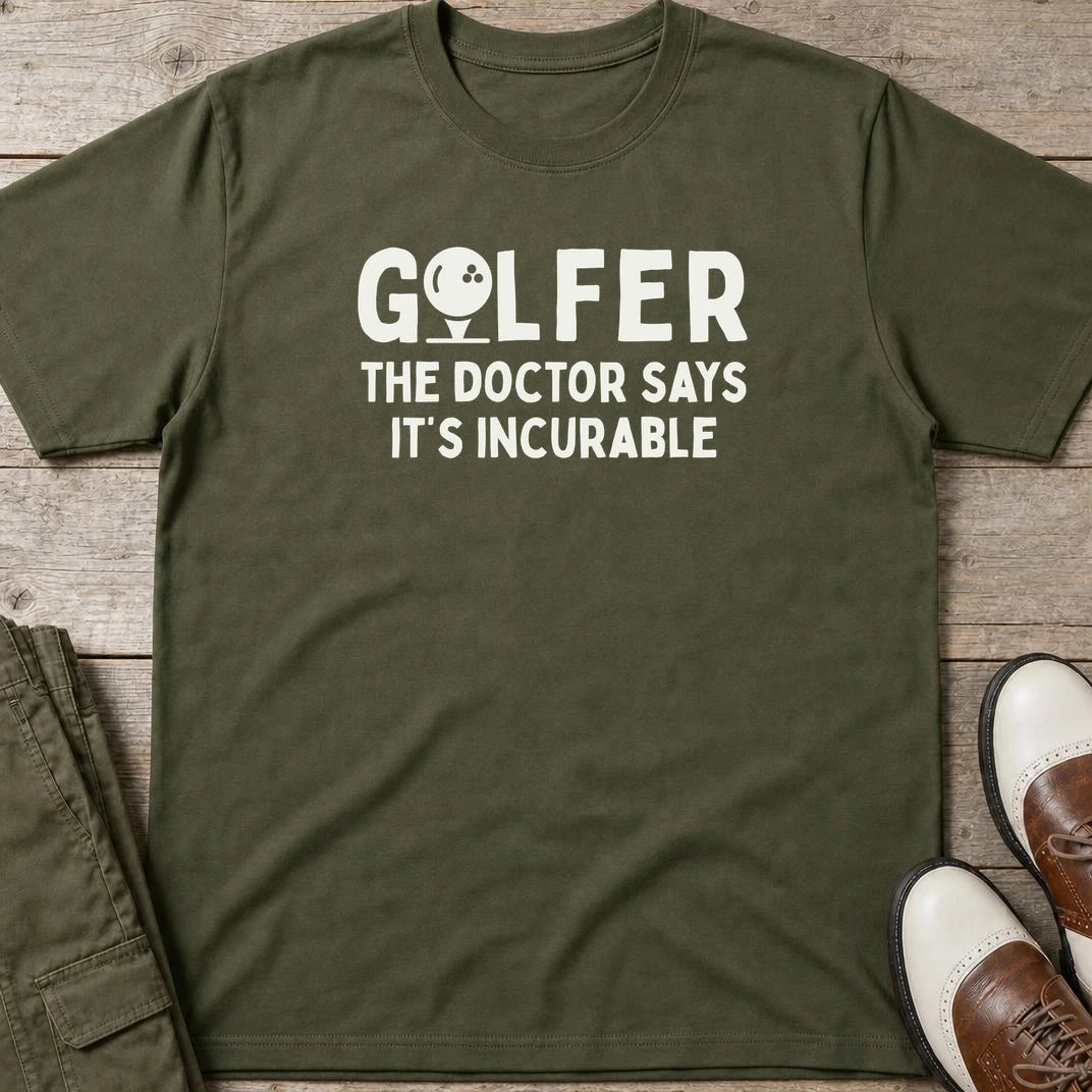 Golfer Incurable T-Shirt in Military Green lying on a plain floor. T-shirt is a unisex cut and 100 per cent cotton.