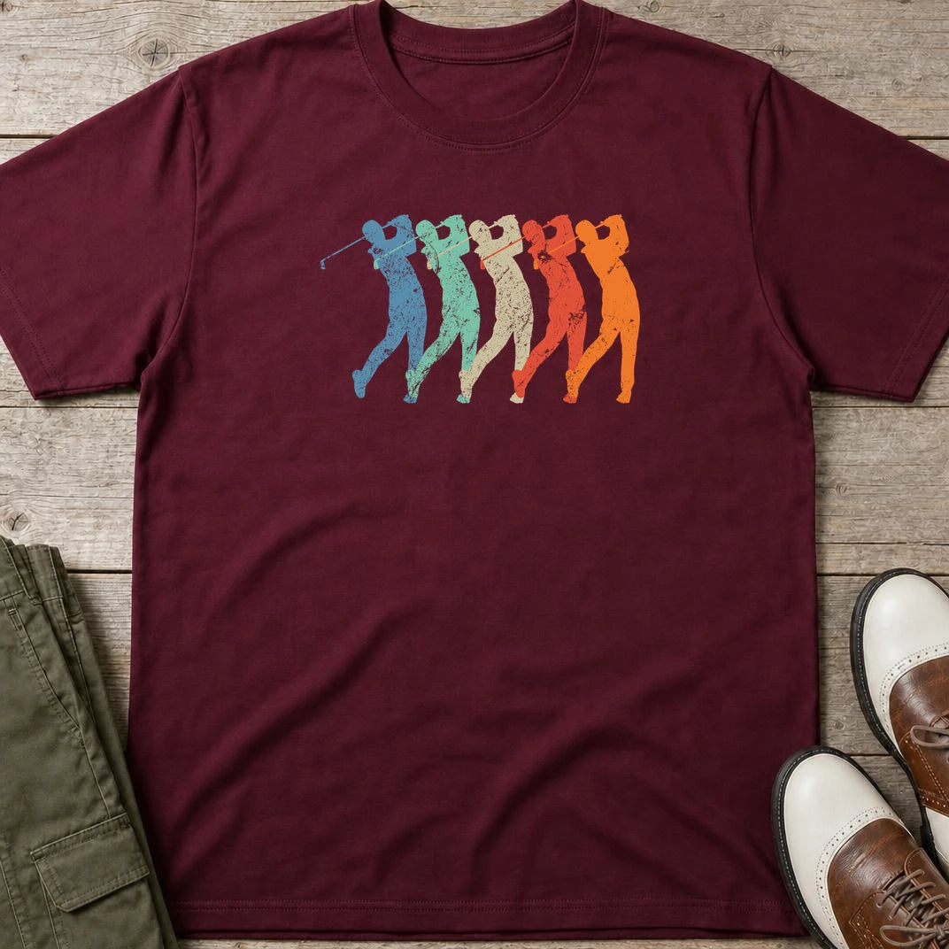 Golf Swing T-Shirt in Maroon lying on a plain floor. T-shirt is a unisex cut and 100 per cent cotton.