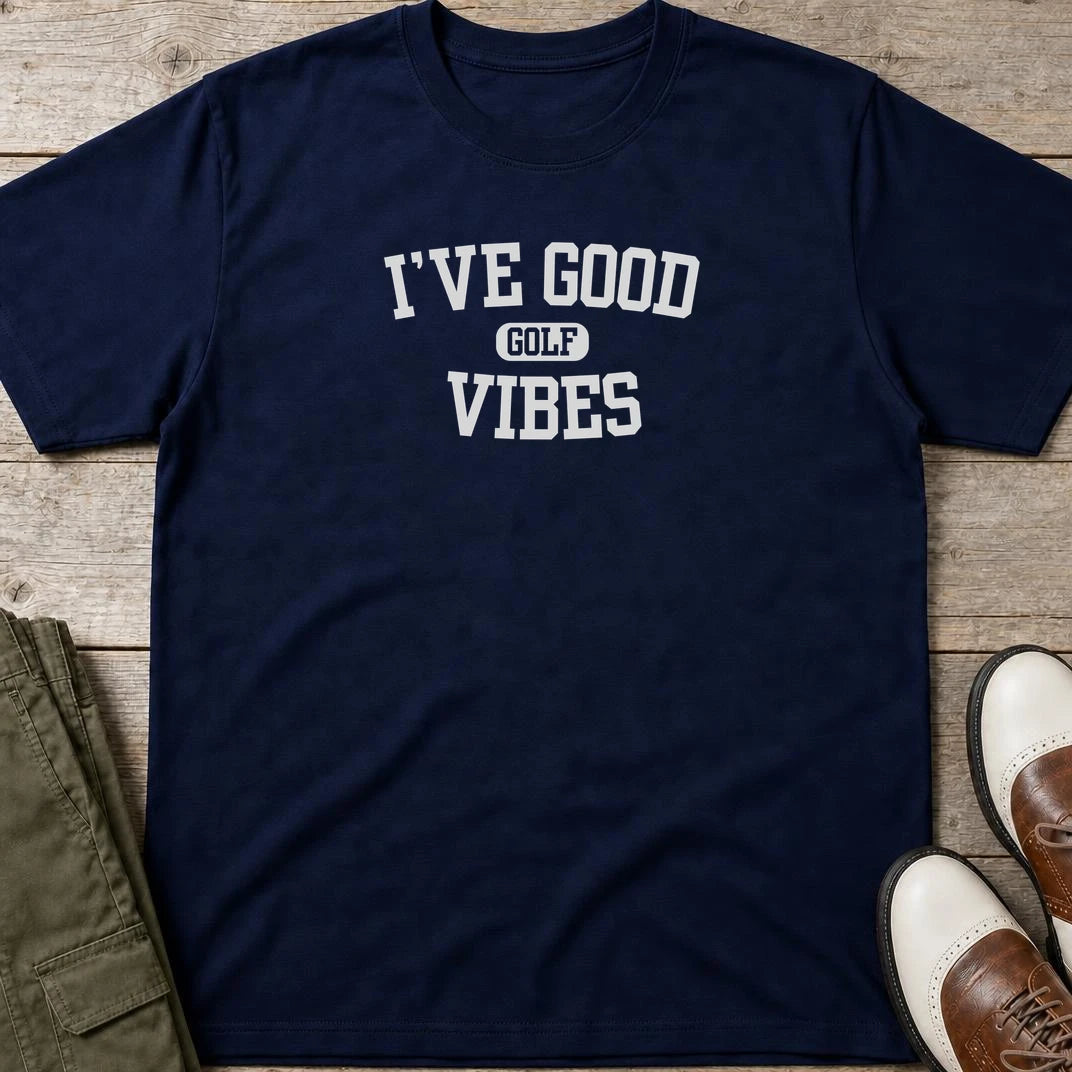 Golf Vibes T-Shirt in Navy lying on a plain floor. T-shirt is a unisex cut and 100 per cent cotton.