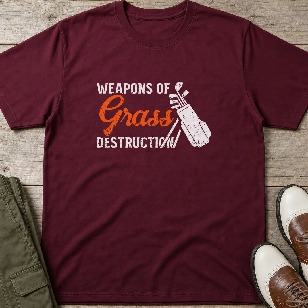 Weapons T-Shirt in Maroon lying on a plain floor. T-shirt is a unisex cut and 100 per cent cotton.