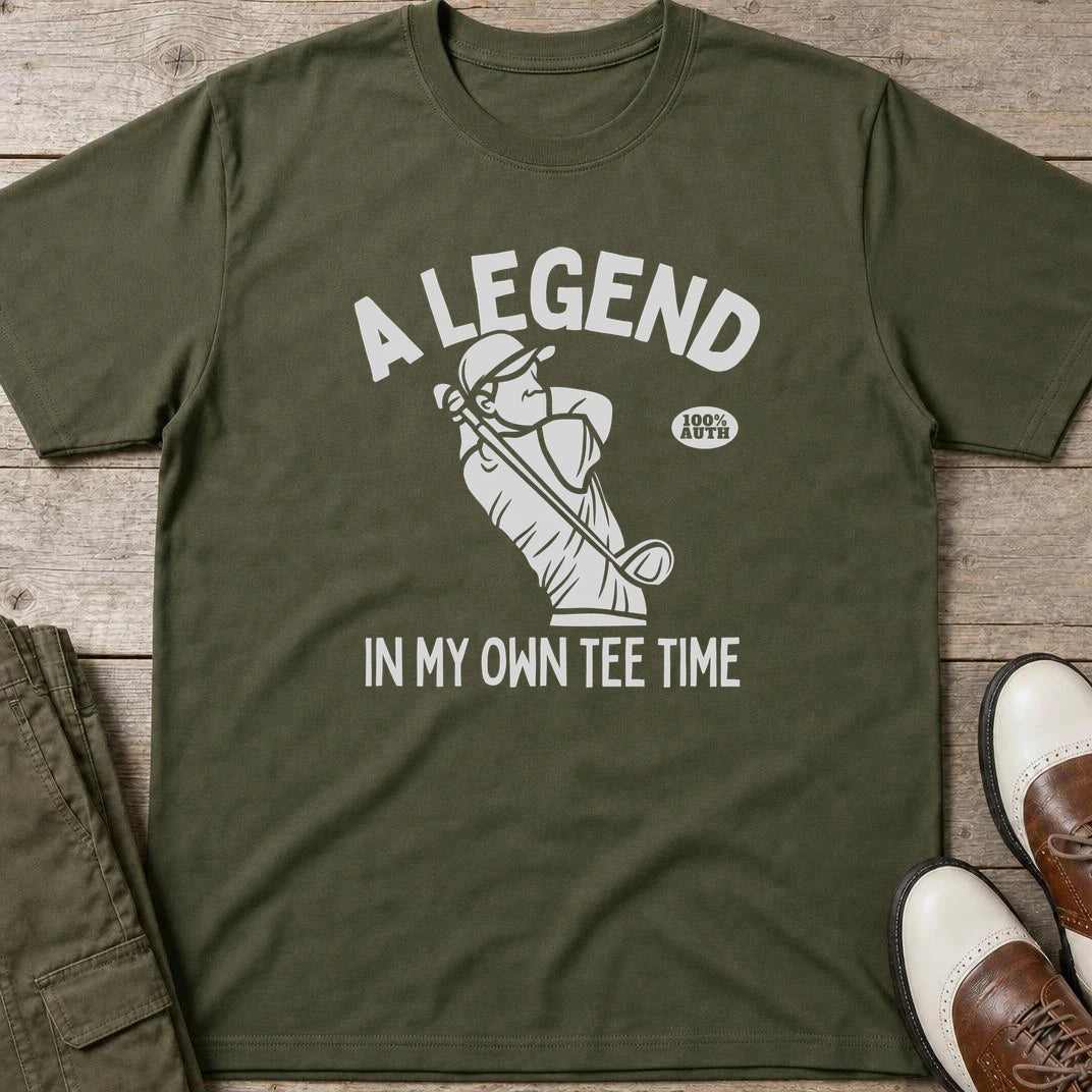 Own Tee Time T-Shirt in Military Green lying on a plain floor. T-shirt is a unisex cut and 100 per cent cotton.