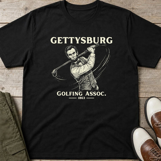 Gettysburg T-Shirt in Black lying on a plain floor. T-shirt is a unisex cut and 100 per cent cotton.