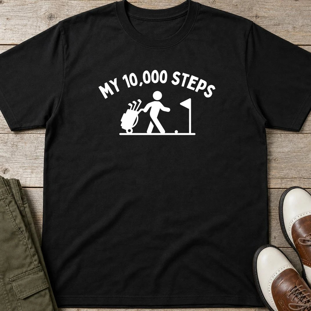My 10,000 Steps T-Shirt in Black lying on a plain floor. T-shirt is a unisex cut and 100 per cent cotton.