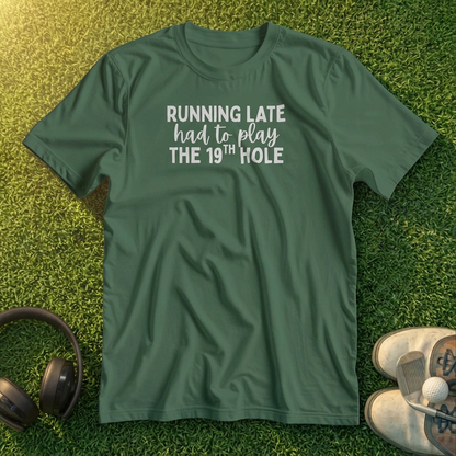 Running Late T-Shirt in lying on a plain floor. T-shirt is a unisex cut and 100 per cent cotton.