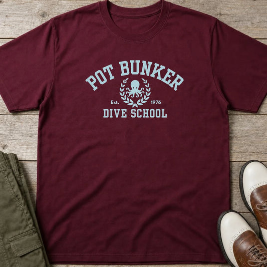 Pot Bunker T-Shirt in Maroon lying on a plain floor. T-shirt is a unisex cut and 100 per cent cotton.