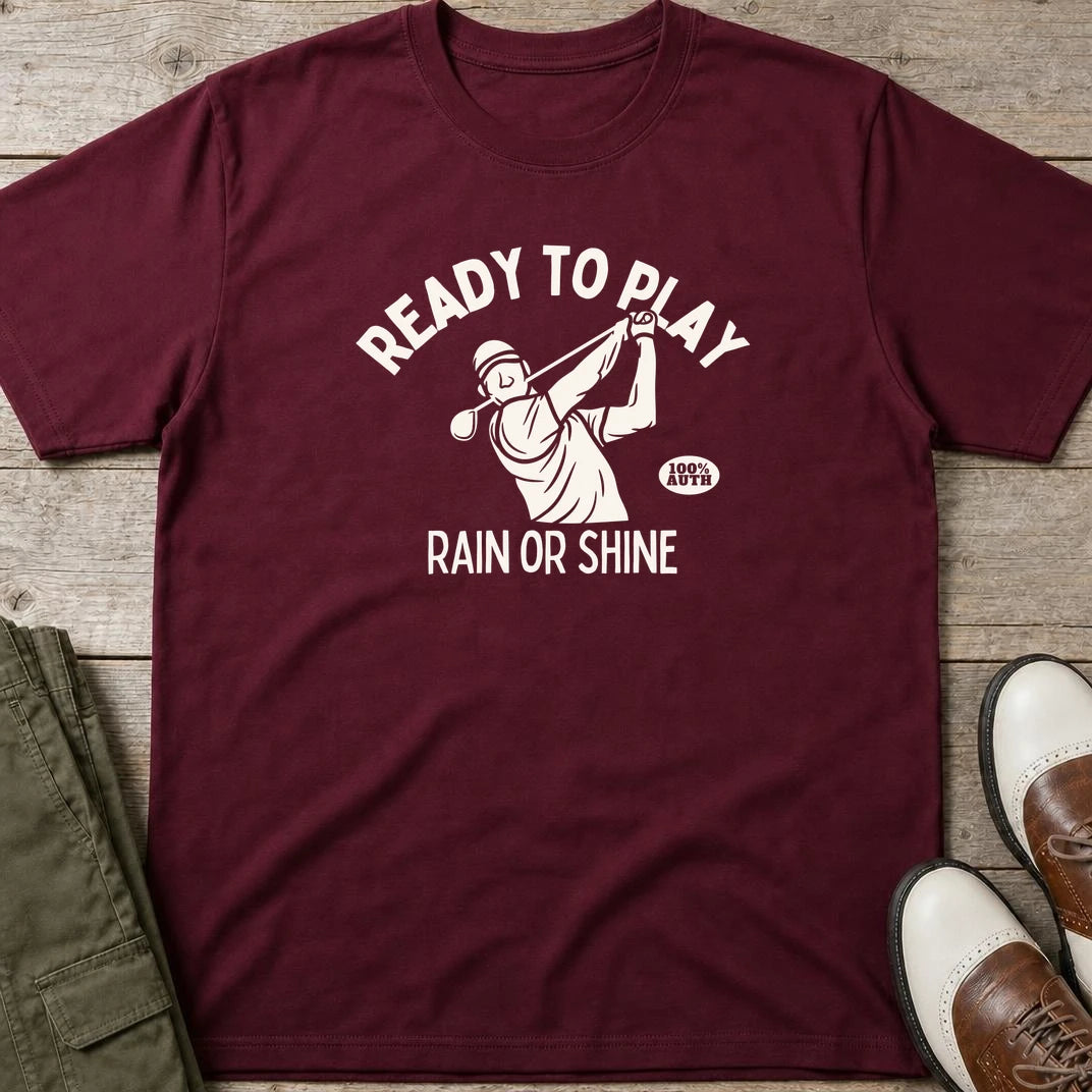 Ready To Play T-Shirt in Maroon lying on a plain floor. T-shirt is a unisex cut and 100 per cent cotton.