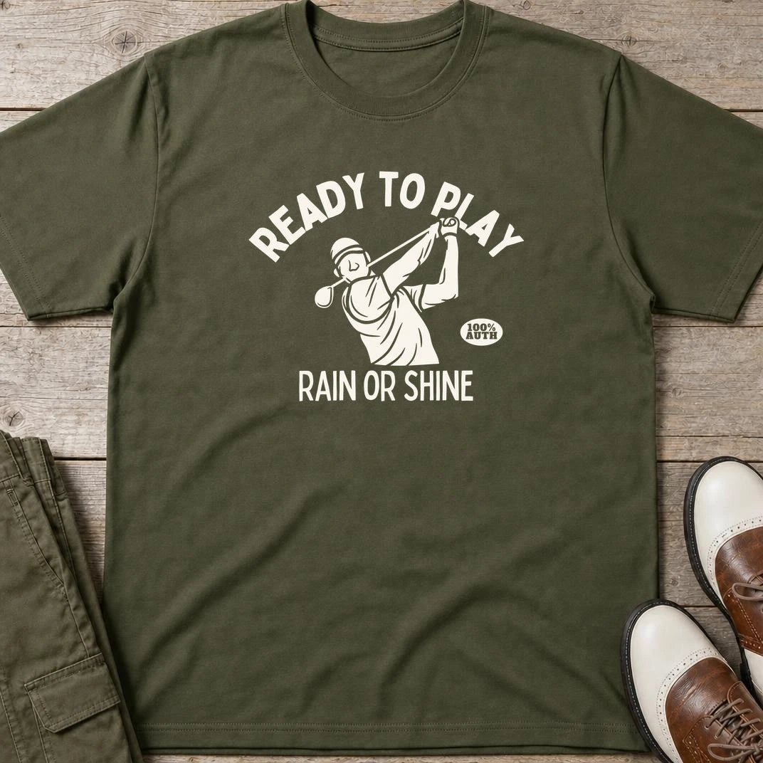 Ready To Play T-Shirt in Military Green lying on a plain floor. T-shirt is a unisex cut and 100 per cent cotton.