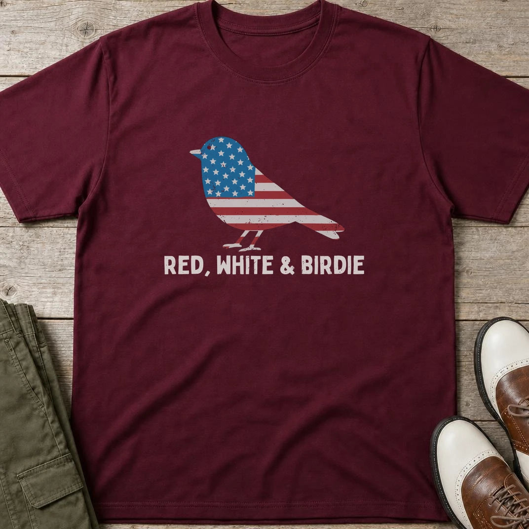 Red White Birdie T-Shirt in Maroon lying on a plain floor. T-shirt is a unisex cut and 100 per cent cotton.