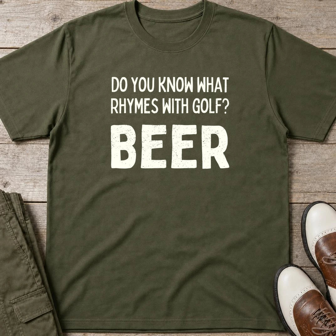 Rhymes With Golf T-Shirt in Military Green lying on a plain floor. T-shirt is a unisex cut and 100 per cent cotton.