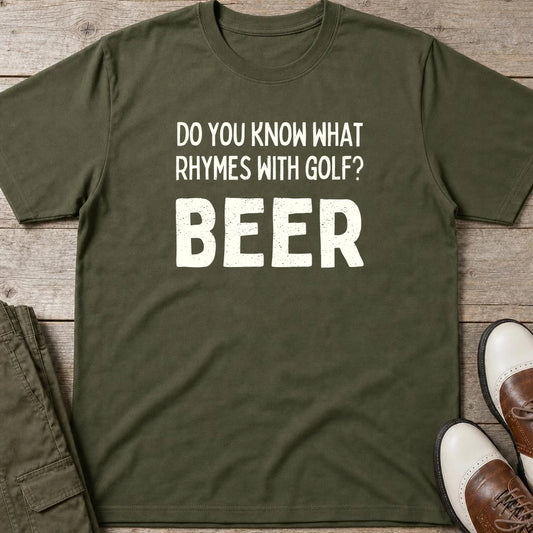 Rhymes With Golf T-Shirt in Military Green lying on a plain floor. T-shirt is a unisex cut and 100 per cent cotton.