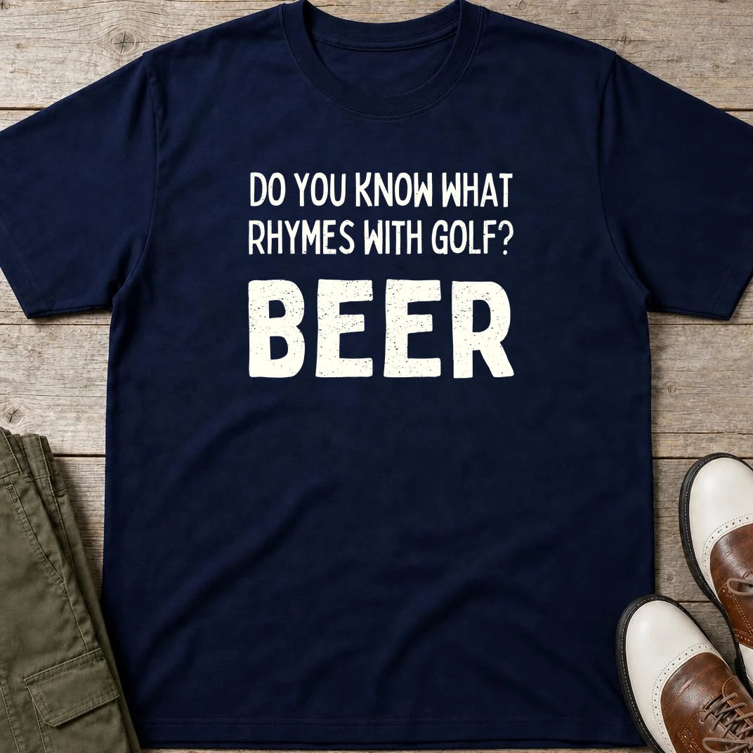 Rhymes With Golf T-Shirt in Navy lying on a plain floor. T-shirt is a unisex cut and 100 per cent cotton.