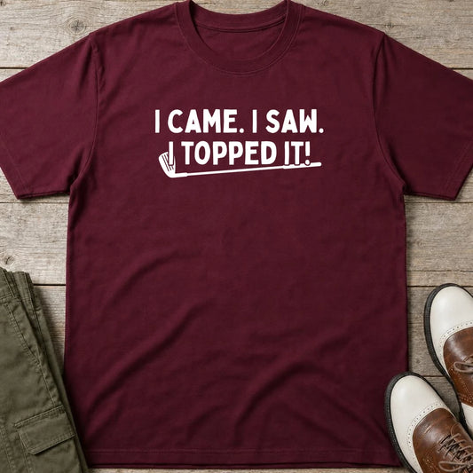 Topped It T-Shirt in Maroon lying on a plain floor. T-shirt is a unisex cut and 100 per cent cotton.