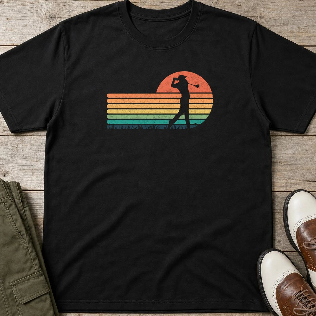 Vintage Golfer T-Shirt in Black lying on a plain floor. T-shirt is a unisex cut and 100 per cent cotton.