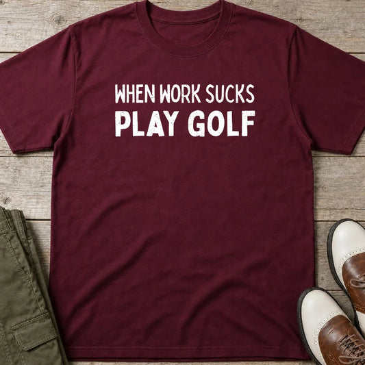 Work Sucks T-Shirt in Maroon lying on a plain floor. T-shirt is a unisex cut and 100 per cent cotton.