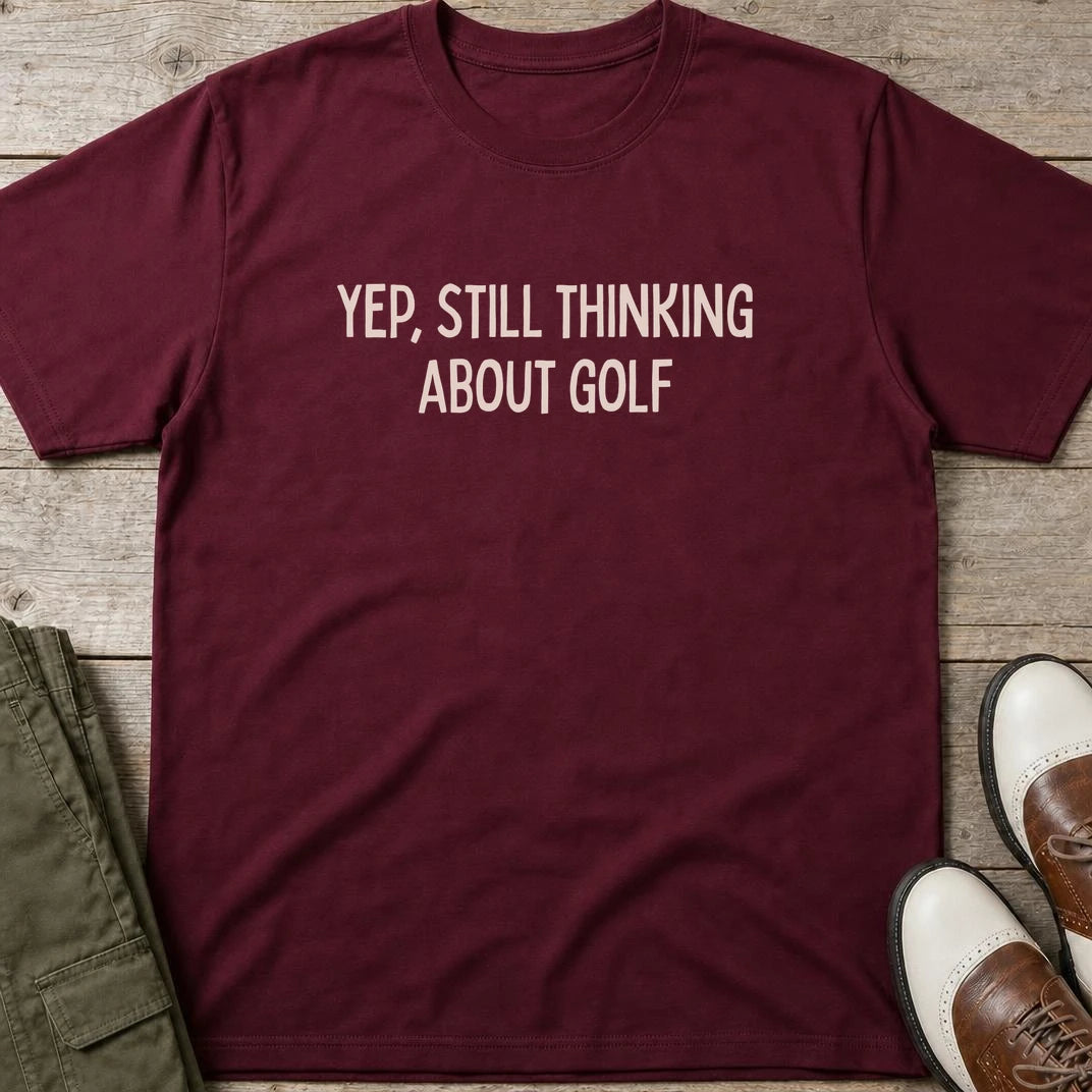 Still Thinking T-Shirt in Maroon lying on a plain floor. T-shirt is a unisex cut and 100 per cent cotton.