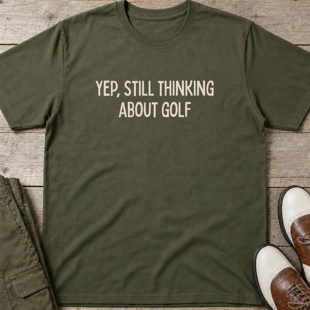 Still Thinking T-Shirt in Military Green lying on a plain floor. T-shirt is a unisex cut and 100 per cent cotton.