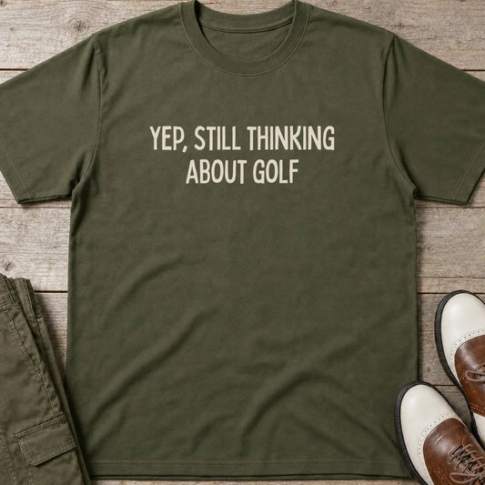 Still Thinking T-Shirt in Military Green lying on a plain floor. T-shirt is a unisex cut and 100 per cent cotton.